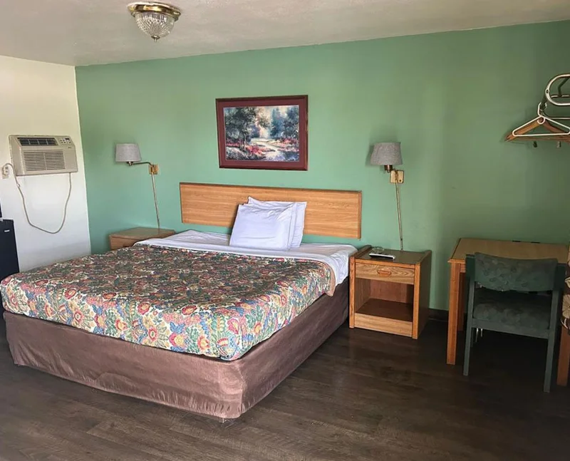 One-bed room photographed at Hillcrest Motel